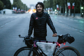 Lachlan Morton pictured in Paris after riding more than 5000 kilometres, including the entire Tour de France route, last year. 