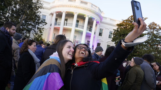 Aparna Shrivastava, right, with her partner Shelby Teeter after President Joe Biden signed the bill into law on the South Lawn of the White House in Washington.