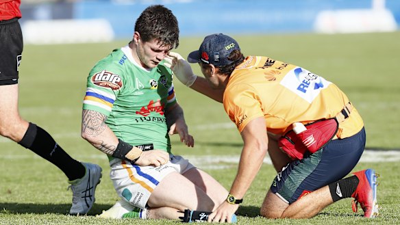 Man down: In-form Raider John Bateman suffered a suspected fractured eye socket.