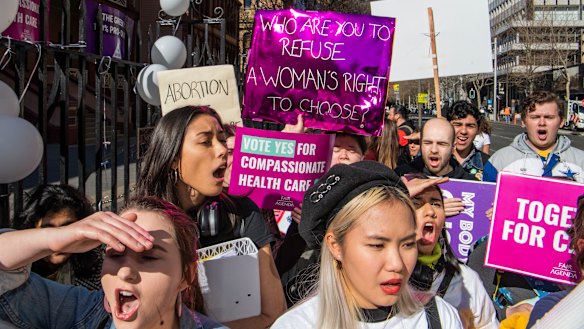 Pro-abortion protesters rally outside the NSW Parliament in Sydney as the state's Abortion Bill is debated on Tuesday.