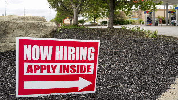 Hiring signs are posted outside a gas station in Cranberry township in Pennsylvania.  Such notices are springing up on streets and shopfronts all over the US.