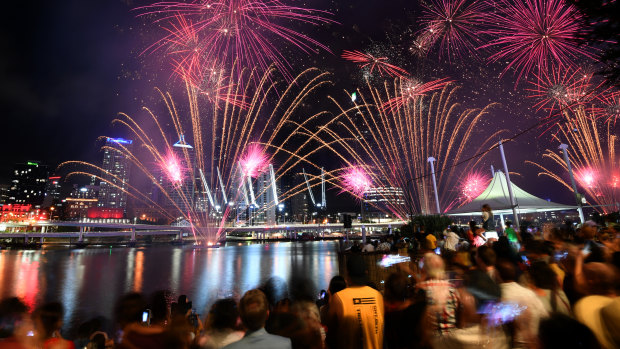 Crowds watch a fireworks display during New Year's Eve celebrations in Brisbane.