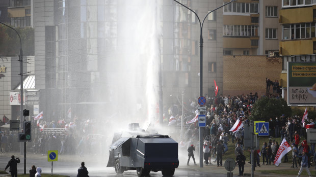 Police use a water cannon toward demonstrators during a rally in Minsk, Belarus on Sunday.