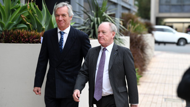 Lawyers for Ardent Leisure Bruce Hodgkinson SC (right) and James Bell QC arrive for the inquest into the Dreamworld disaster at the Magistrates Court at Southport.