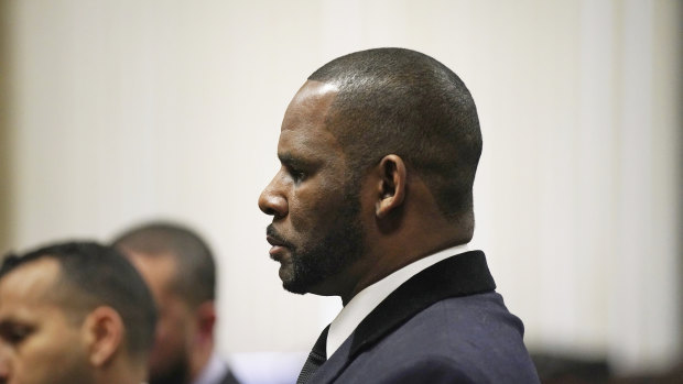 R. Kelly stands during a hearing in his sex abuse case at Leighton Criminal Court Building in May.