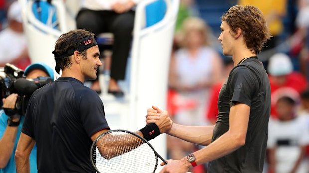 Game, set and match: Federer and Zverev shake hands in Perth.