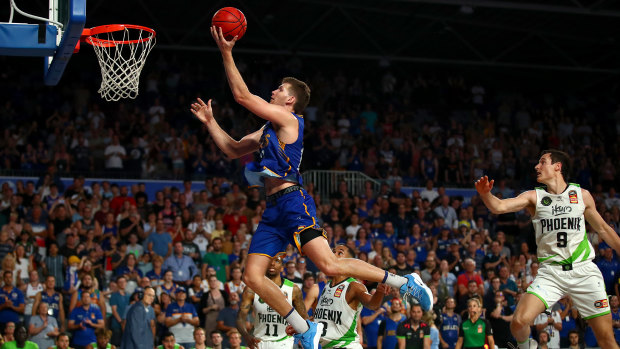 Up and away: Will Magnay flies to the basket for Brisbane against South East Melbourne.