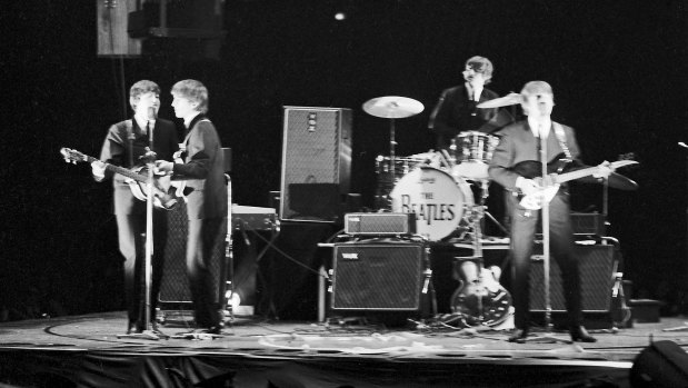 The Beatles perform at Sydney Stadium on June 18, 1964.