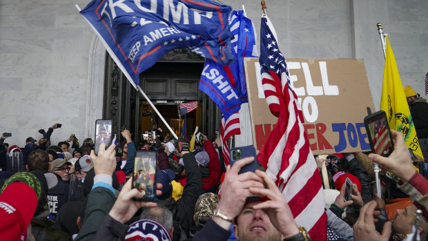 The violent crowd supporting  Donald Trump riot outside the Capitol in Washington.