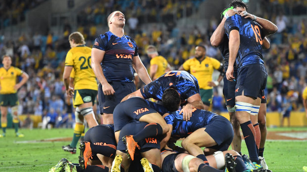 Breakthrough: Pumas players celebrate holding on for victory for the first time on Australian soil.