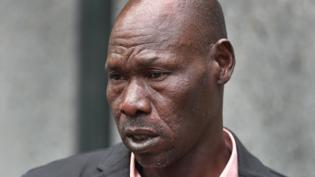 Laa Chol's father outside court on Friday.