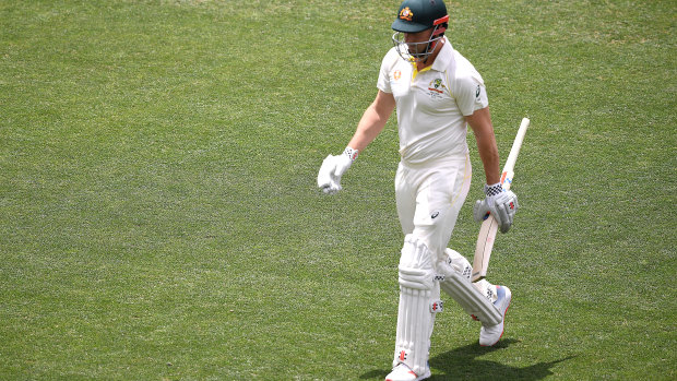 Run of outs: Shaun Marsh leaves the field after being dismissed for two in Adelaide on Friday.