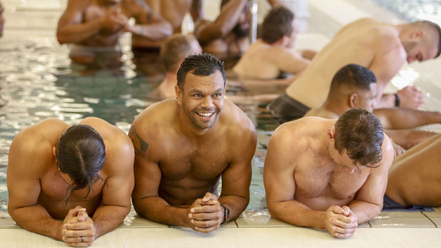Grinners: Kurtley Beale all smiles at Australia's recovery session in Brisbane on Sunday. 