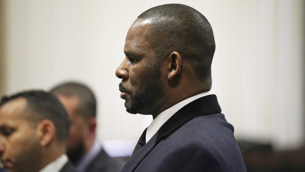 R. Kelly stands during a hearing in his sex abuse case at Leighton Criminal Court Building in May.