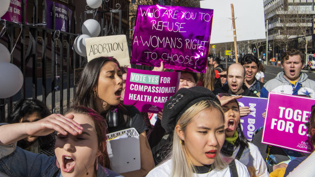 Pro-abortion protesters rally outside the NSW Parliament in Sydney as the state's Abortion Bill is debated on Tuesday.