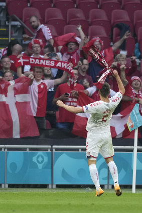 Denmark’s Joakim Maehle celebrates with fans.