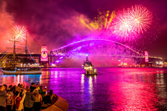 Crowds cheered as the fireworks began, swirling from barges in the harbour as well as the bridge.