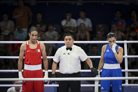 Italy’s Angela Carini (right) fights back tears after her fight against Algeria’s Imane Khelif.