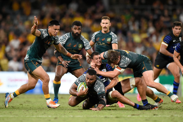 Samu Kerevi, pictured being tackled, was among the Wallabies’ best on Saturday.