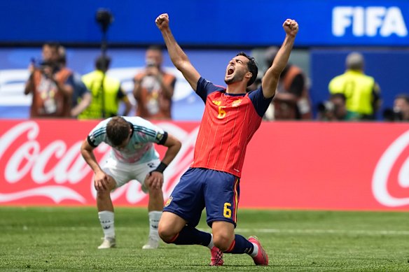 Mikel Merino celebrates Spain’s victory at the full-time whistle.