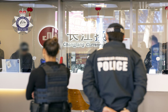 AFP officers raid a Changjiang branch in Sydney CBD.