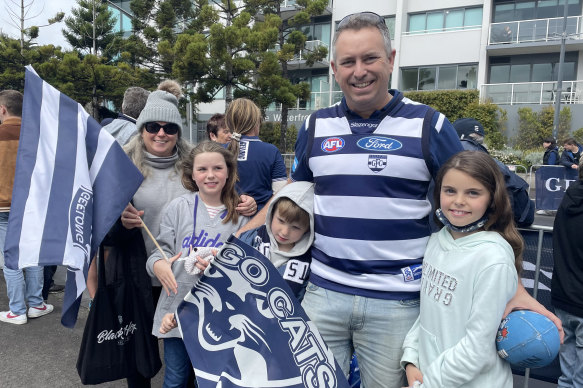 Matt Macfarlane with wife Kylie, 10-year-old twin daughters Grace and Maddie and seven-year-old Jackson during Geelong’s premiership parade.