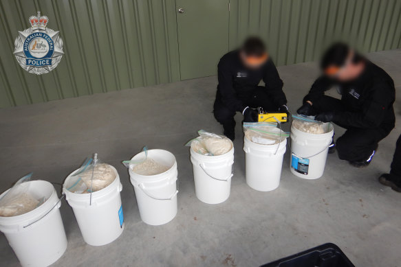 The AFP with drugs seized from a clandestine laboratory in July 2022.