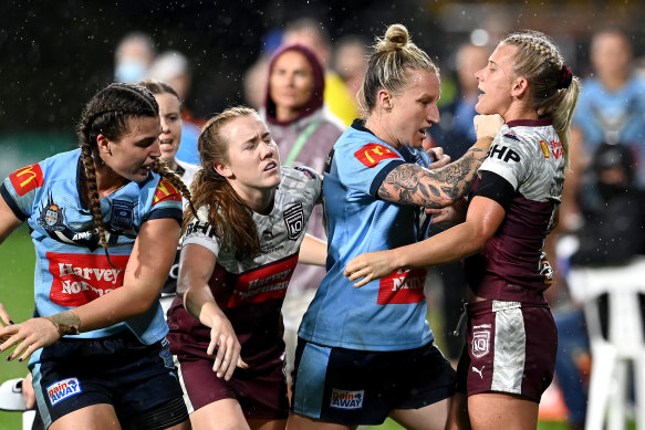 Holli Wheeler of NSW and Shenae Ciesiolka come to grips on Friday night.