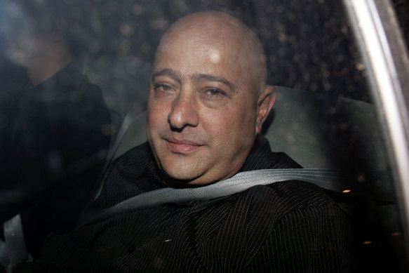 Francesco Madafferi in the back of a police car in 2009.