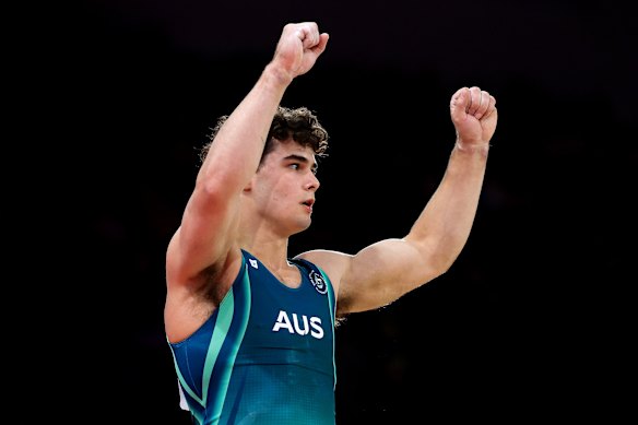 James Hardy celebrates after his routine in the men’s floor exercise final.