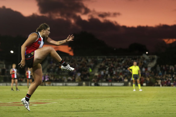 Caitlin Greiser kicks a goal for the Saints in the AFLW win over Melbourne.