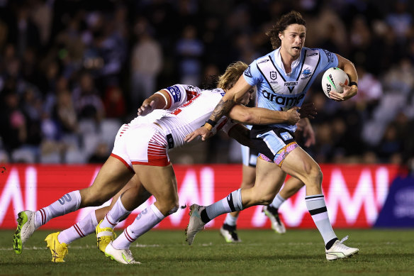 Nicho Hynes tries to break free of the Dragons’ defence.