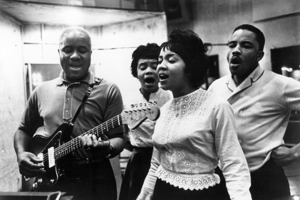 Mavis Staples (front) performing with her father and siblings circa 1970. 