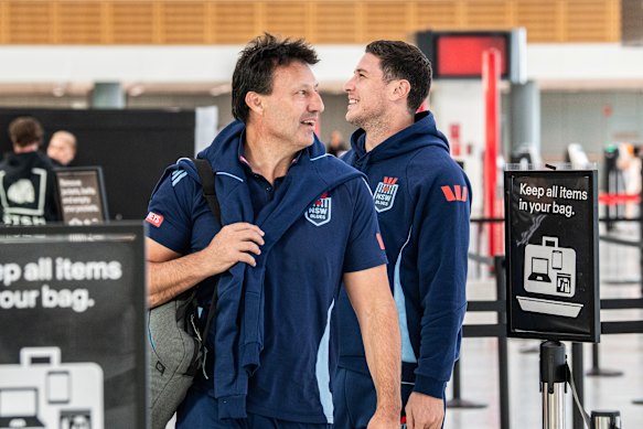 Mitchell Moses with Blues coach Laurie Daley at Sydney airport on Sunday.