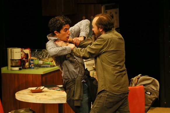 Steve Mouzakis and Karl Richmond wrestle in MTC’s The Lifespan of a Fact.