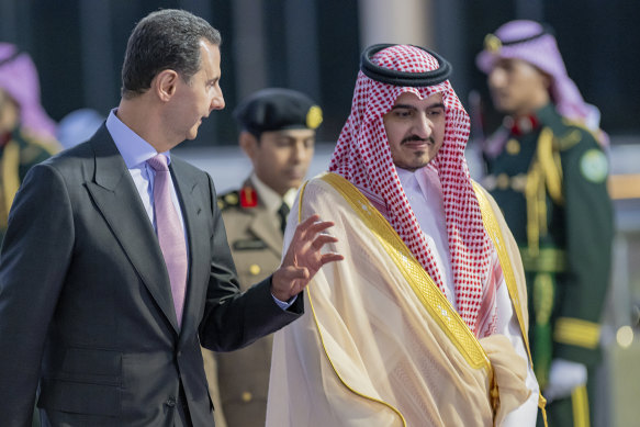 Syrian President Bashar Assad (left) and Prince Bandar Bin Sultan, the deputy governor of Makkah, at Jeddah airport, Saudi Arabia.