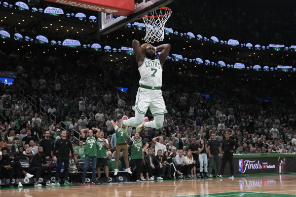 Boston Celtics guard Jaylen Brown goes up for a dunk.