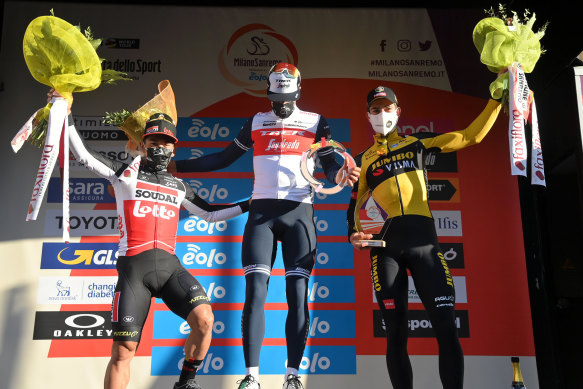 Jasper Stuyven on the podium, centre, with runner-up Caleb Ewan, left, and Wout van Aert, right, who was third. 