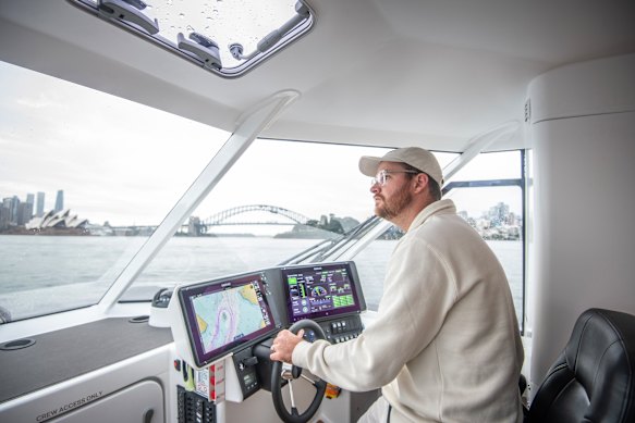 Dan de Jong driving the electric hydrofoil in Sydney Harbour.