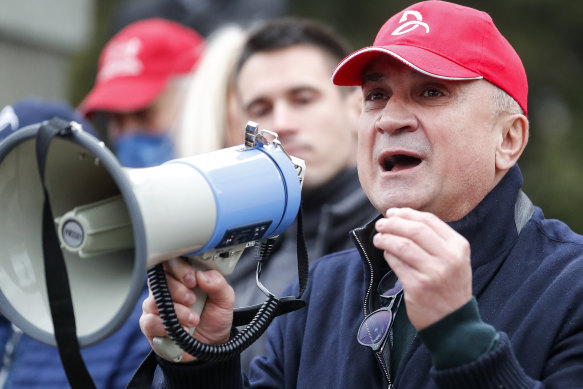 Novak Djokovic’s father Srdjan at a rally in Belgrade. 