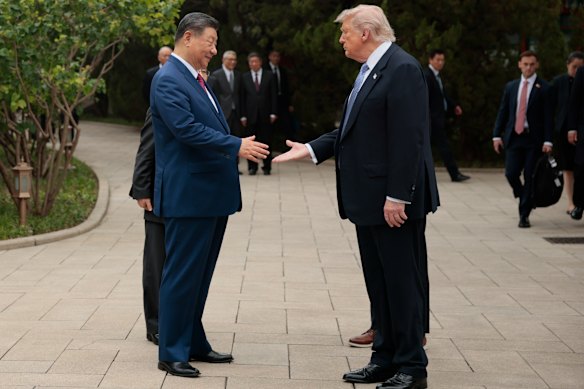 Xi and Trump shake hands at the end of their two-day summit. 
