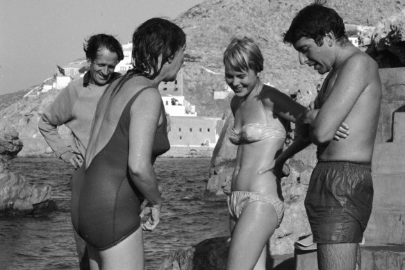From left: George Johnston and Charmian Clift chat to Marianne Ihlen and Leonard Cohen on a Hydra beach, October 1960. 
