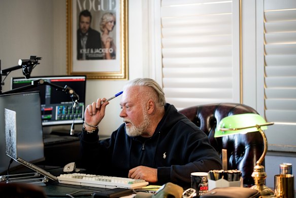 Sandilands speaks to the SMH and The Age with a framed picture of he and Henderson behind his desk.