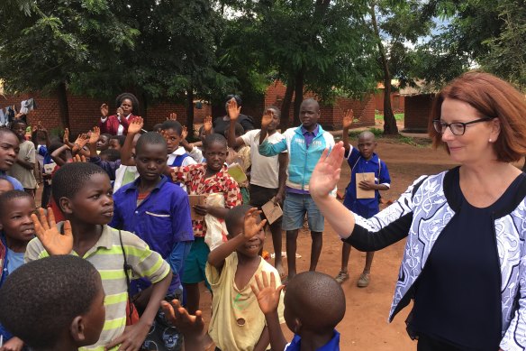 Greeting schoolchildren  in Malawi.