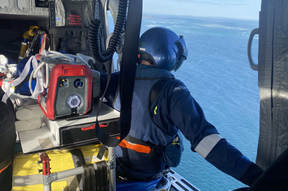 Rescue workers search for Jordan Kelly from one of eight aircraft that scoured the area off North Stradbroke Island on Sunday.