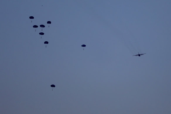 Humanitarian aid is dropped by the United States over Gaza City.