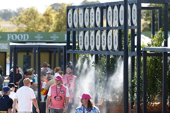 Fans cool off in Lyndoch, South Australia as the AFL comes to the Barossa Valley.