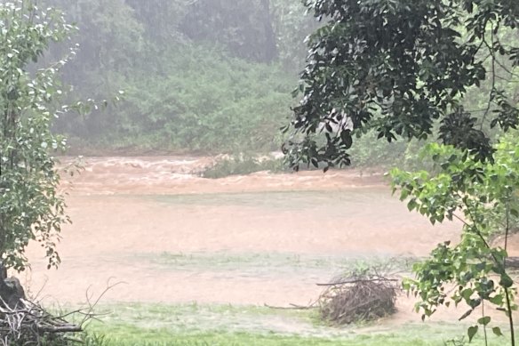 Patrick Tatam’s creek floods his bottom paddock in Whian Whian on Sunday.