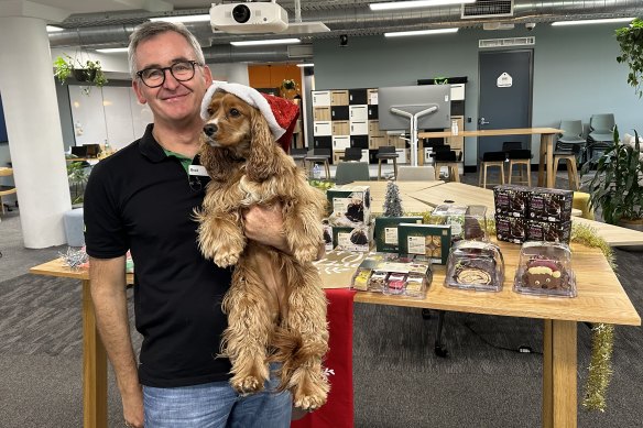 Woolworths CEO Brad Banducci and his king charles cavalier cocker spaniel cross called Juno. About 70 per cent of Australian households have a pet.