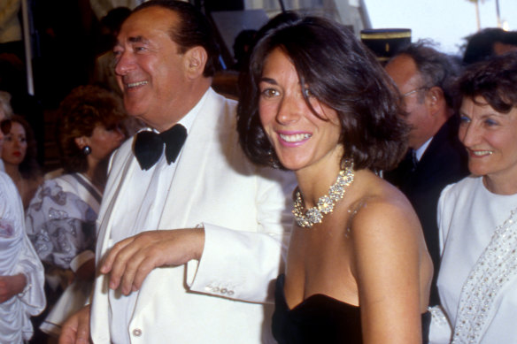 Ghislaine Maxwell, in a black dress, pictured with her father, British media tycoon and fraudster Robert Maxwell.
